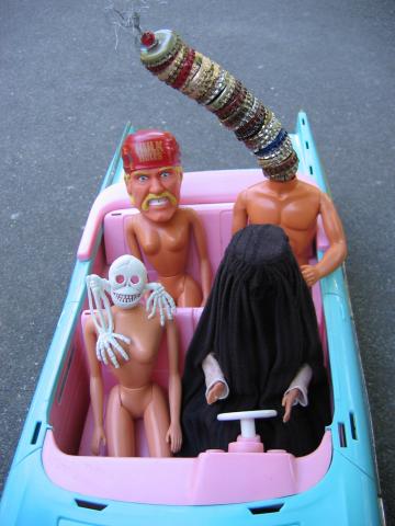 Four Altered Barbies in a Barbie Car